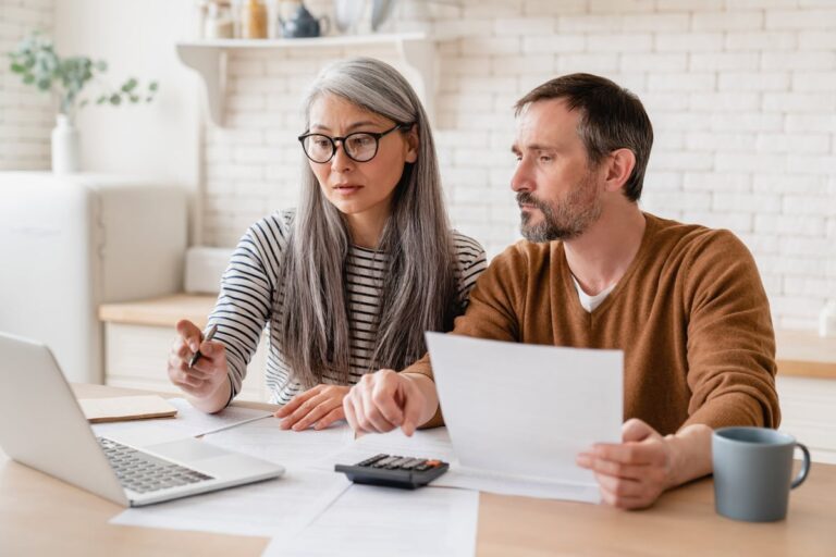 Mature couple working on tax preparation 5lONyY2