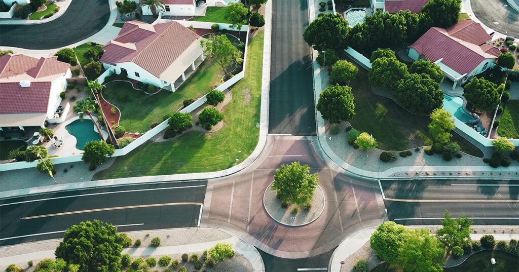 aerial shot of suburban homes avi waxman f9qZuKoZYoY unsplash 1200w 628h