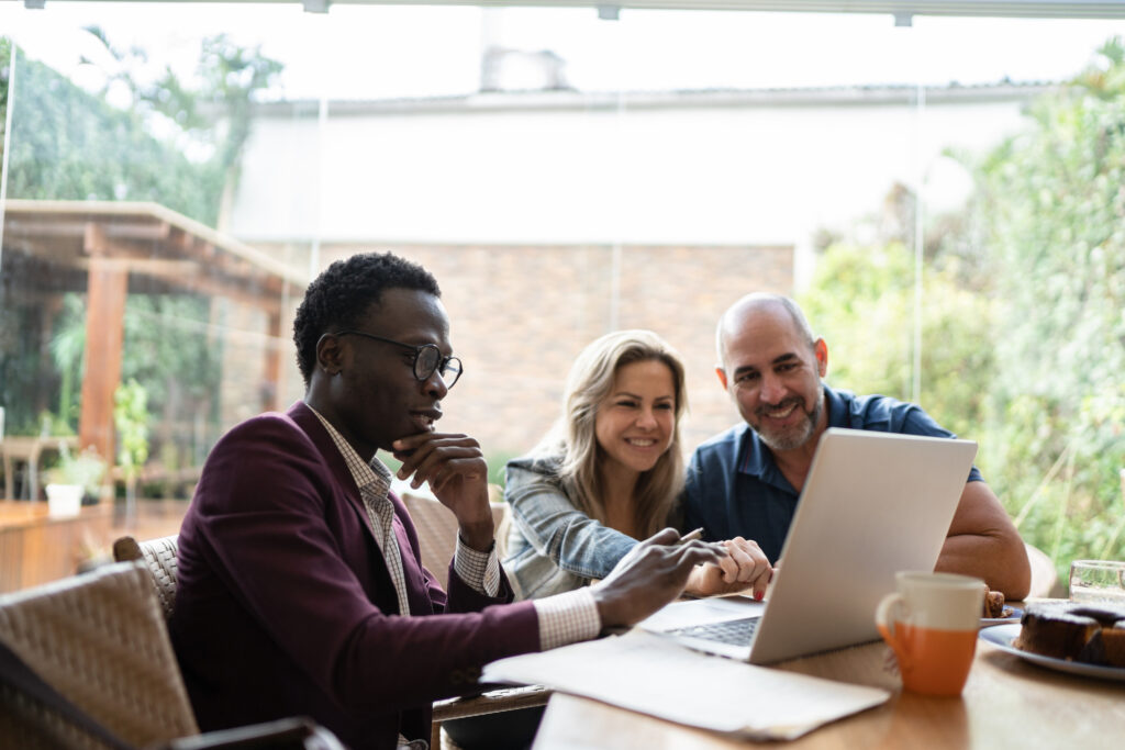 couple meets insurance agent at home getty