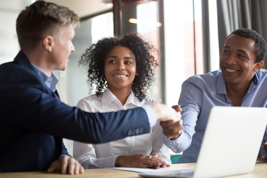 a couple talks to a financial advisor