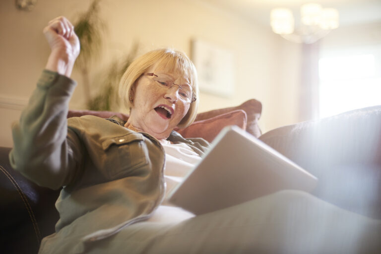 21 05 18 a person with a tablet and a look of happy surprise gettyimages 854218734