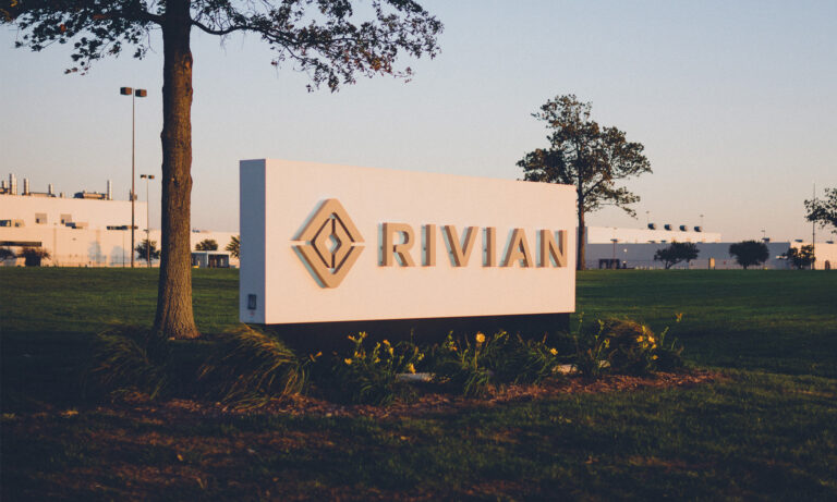 24 06 16 a building with the rivian logo sign on front lawn mf dload image source rivian