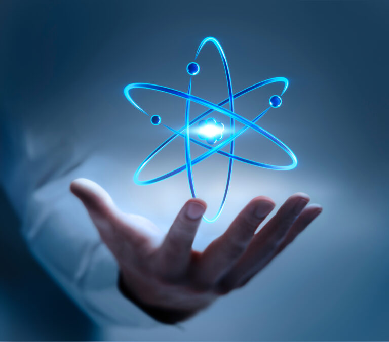 a hand cradles a virtual atom