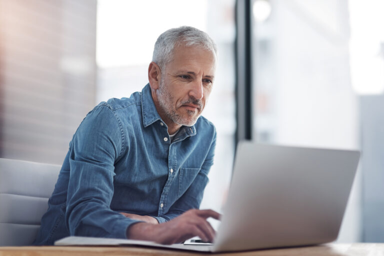 older man on laptop 2022