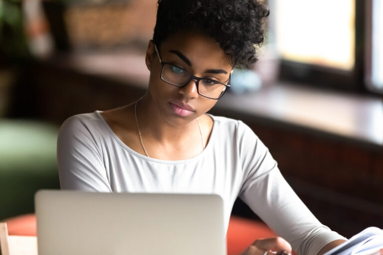 student researches on a computer