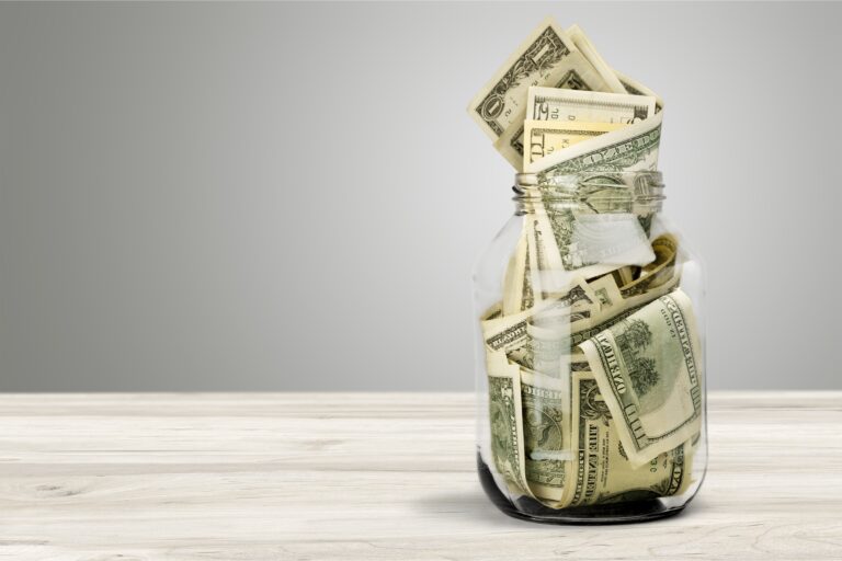 jar full of dollar bills money savings